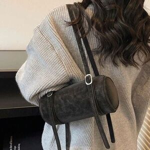 Elegant Black Cylinder Shoulder Bag with charm